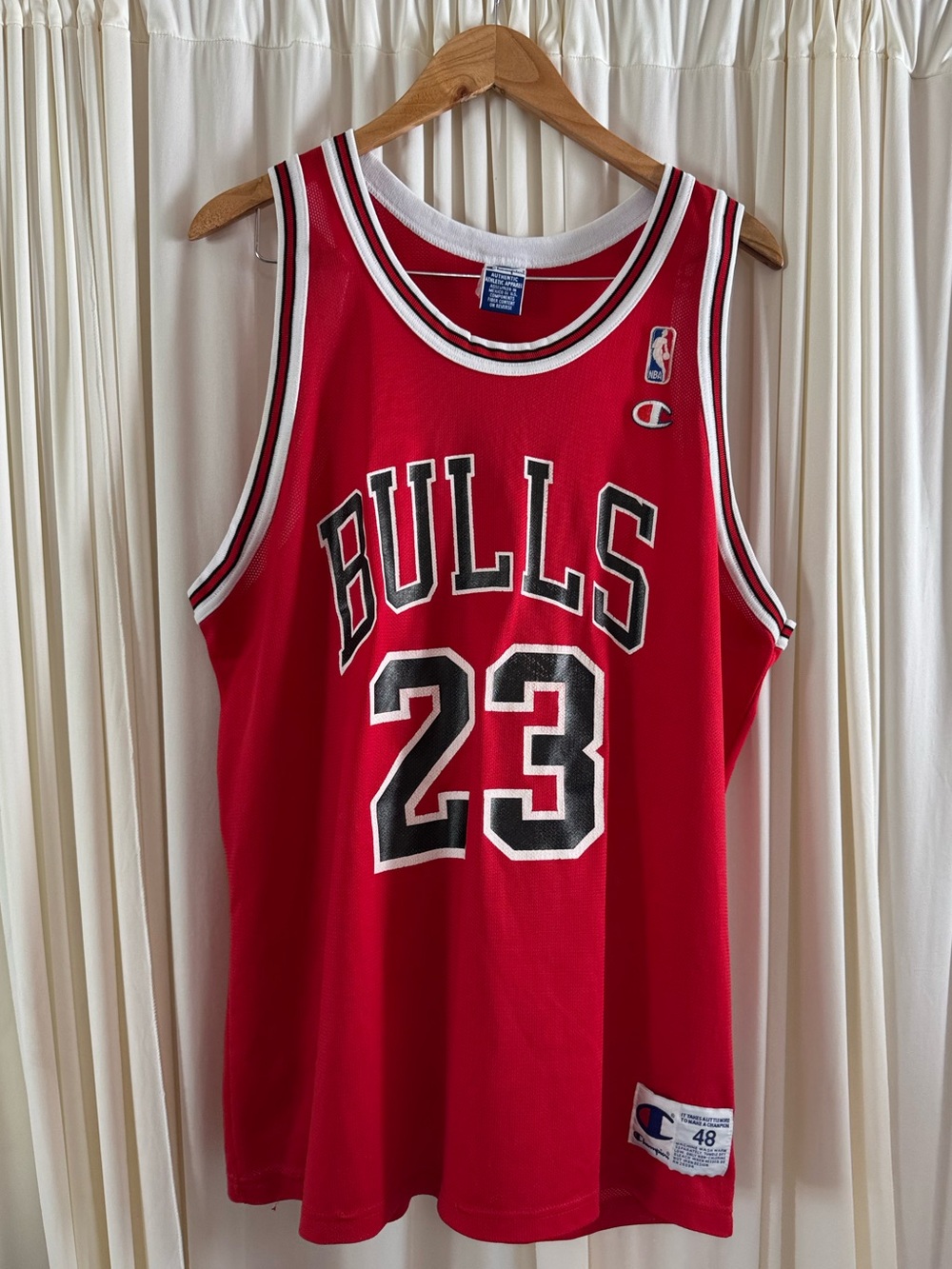 Vintage 90s Champion brand Chicago Bulls #23 Michael Jordan basketball jersey